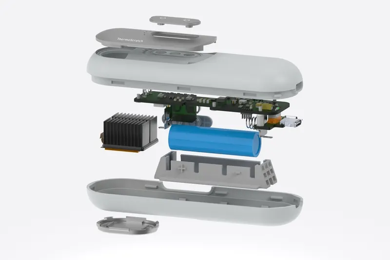 Exploded view of ThermoScratch: the housing, circuit board, heat sink and battery shown floating apart